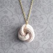 Etarnally. Crochet knot pendant in baby pink.